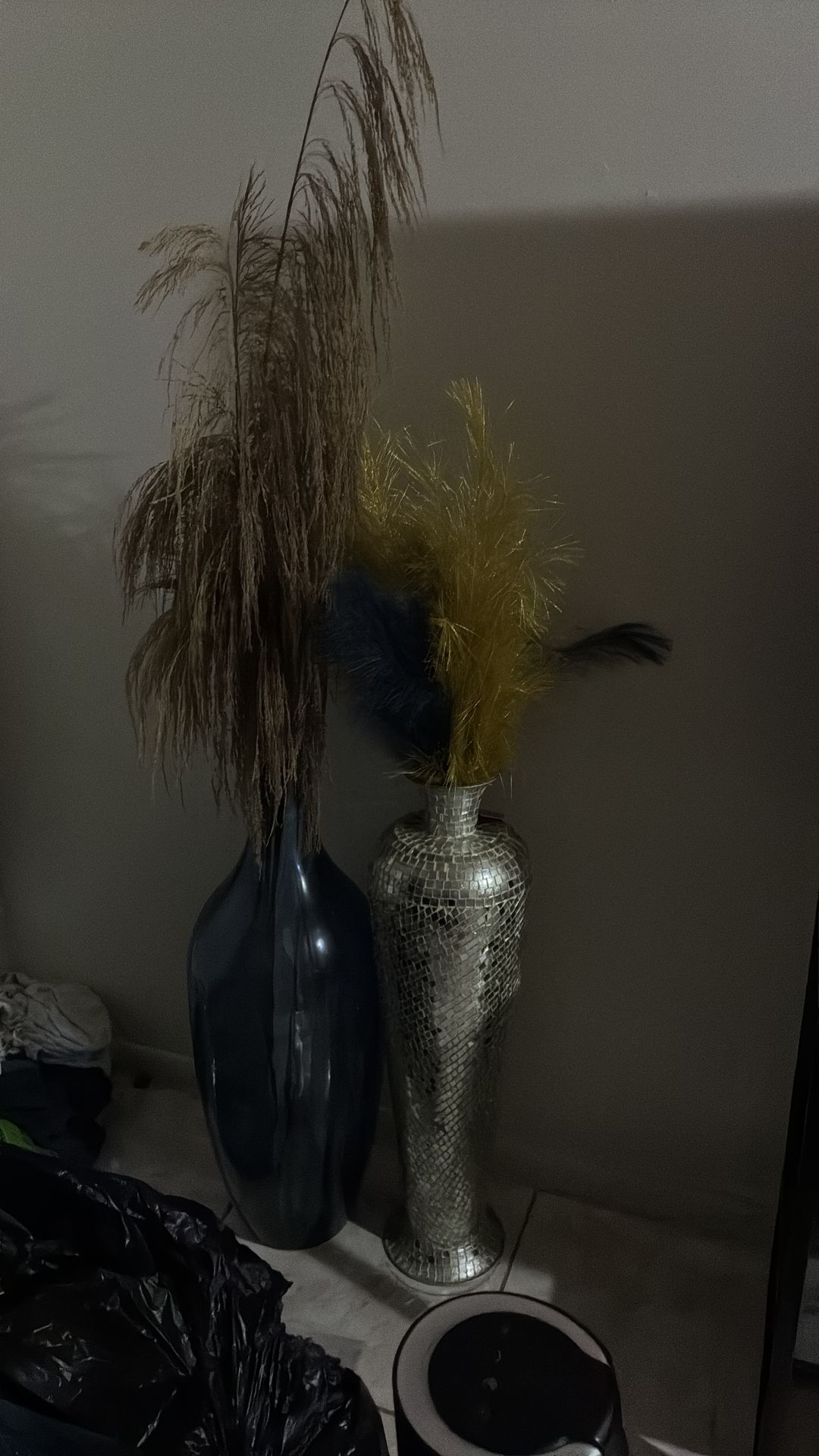 Tall Navy blue vase with gold Flowers and tall silver vase gold and blue feathers