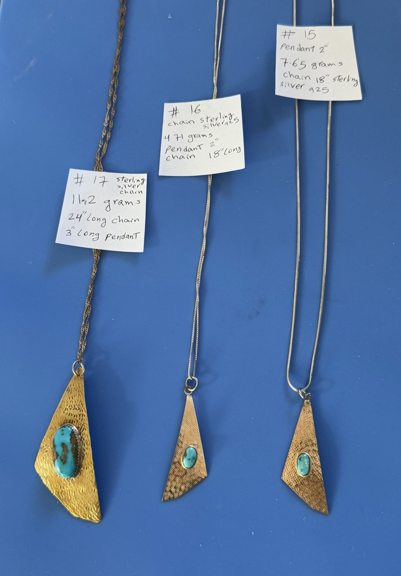 three handmade gold-tone necklaces with turquoise triangle pendants.please Check Out All Photos For More Details .EACH