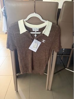 Luxury brand women's blouse. Brow color.