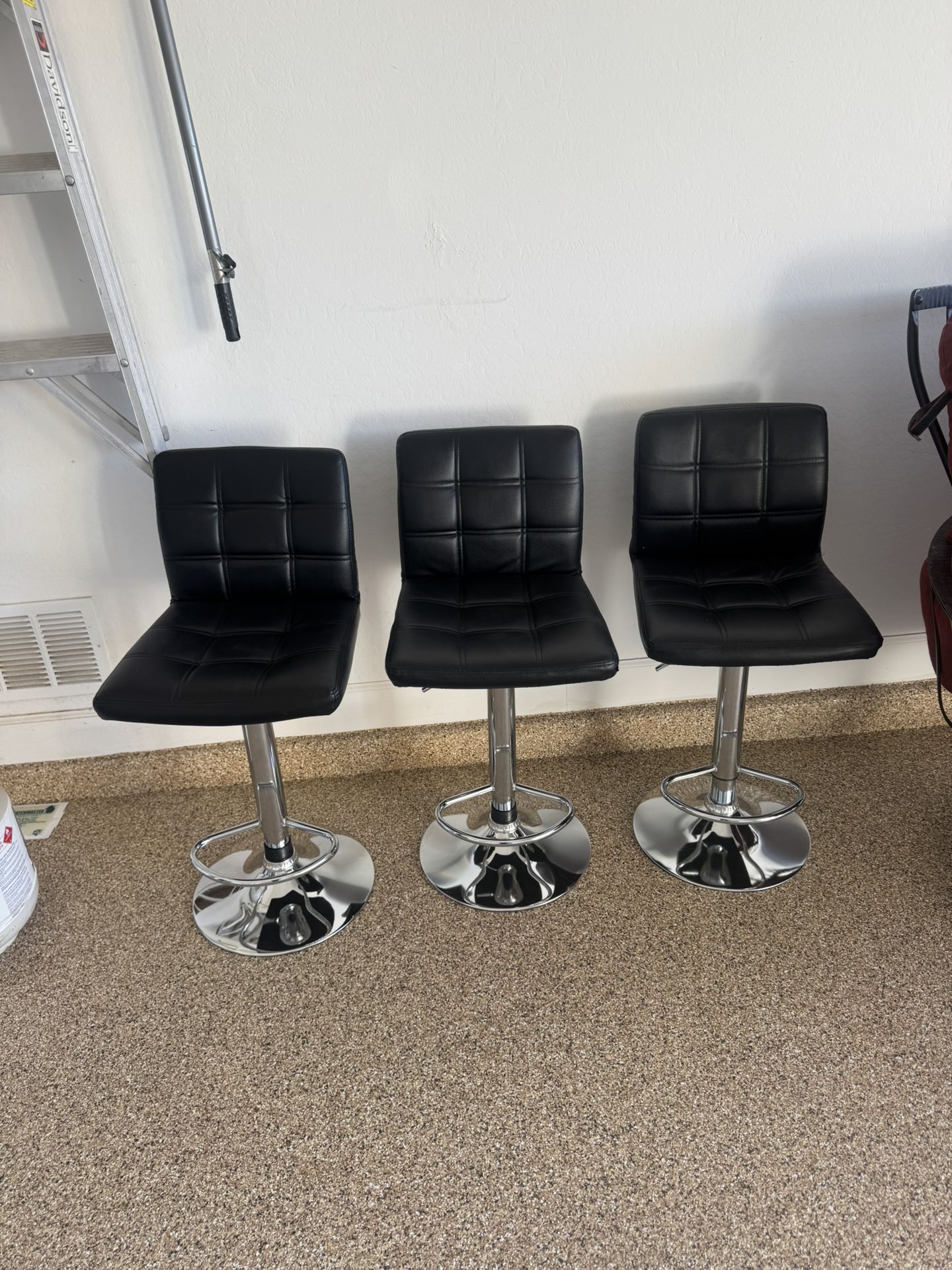3 Black Adjustable Bar Stools. Great Condition. $600 Value