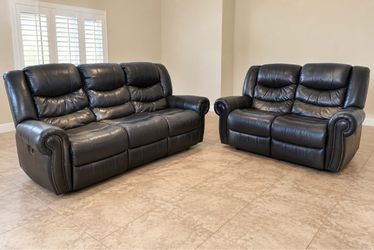 Black leather power reclining sofa and love seat set
