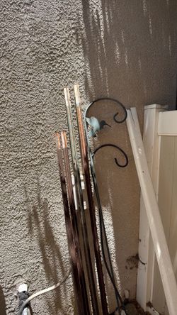 Metal fence and landscaping poles.