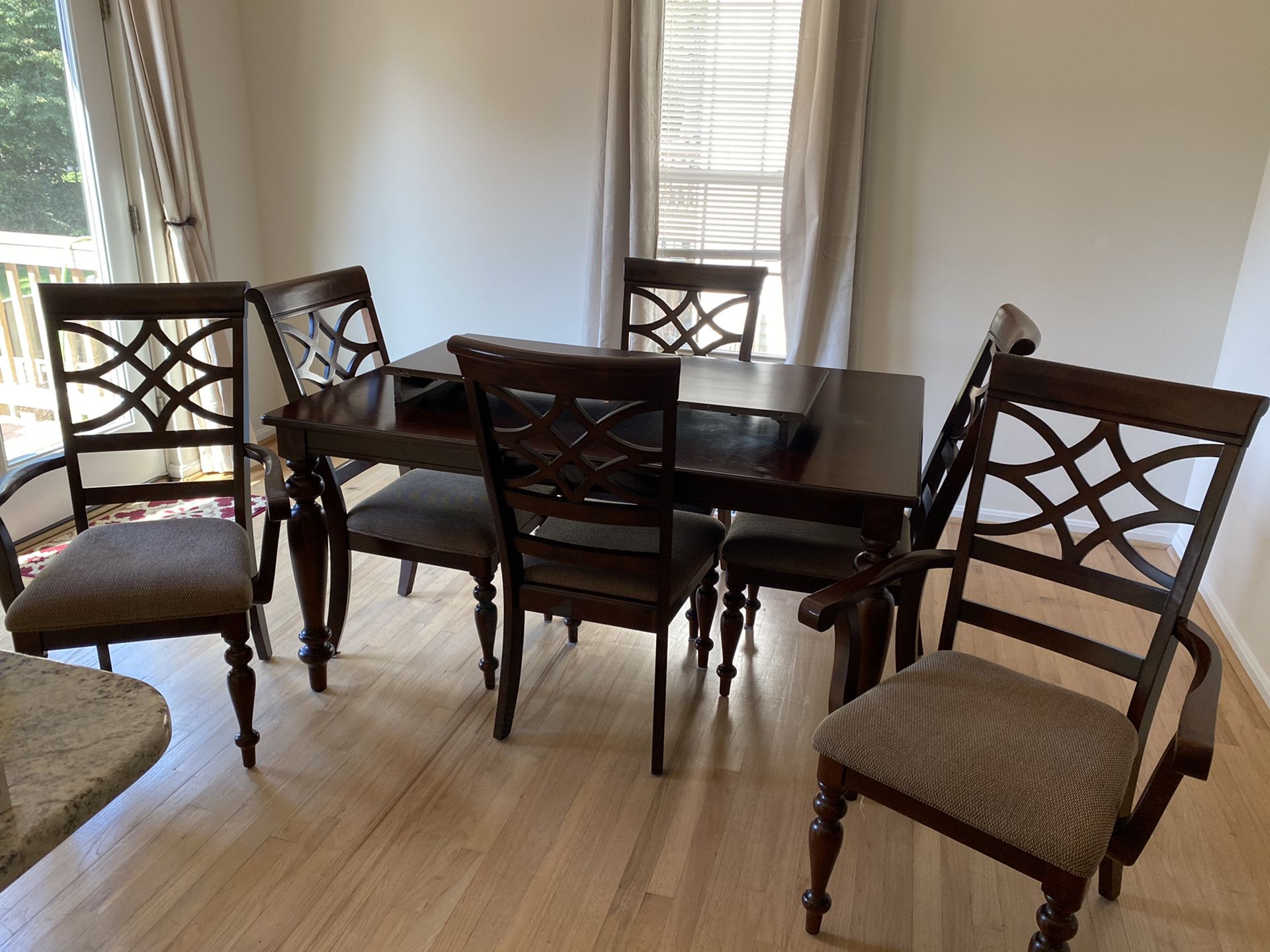 Dining room set with seating for six.