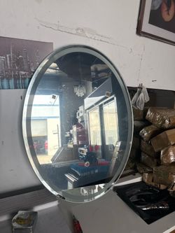 Mirror with standard outlets, has a light, is super cute, It cleans itself with steam. 24”x31” $$