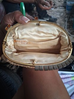 Gold hand bag that's beaded in France