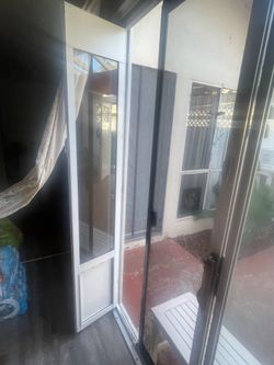 Dog door for sliding glass door with multiple functions