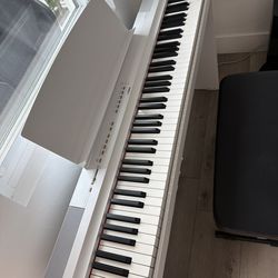 Yamaha piano and piano bench