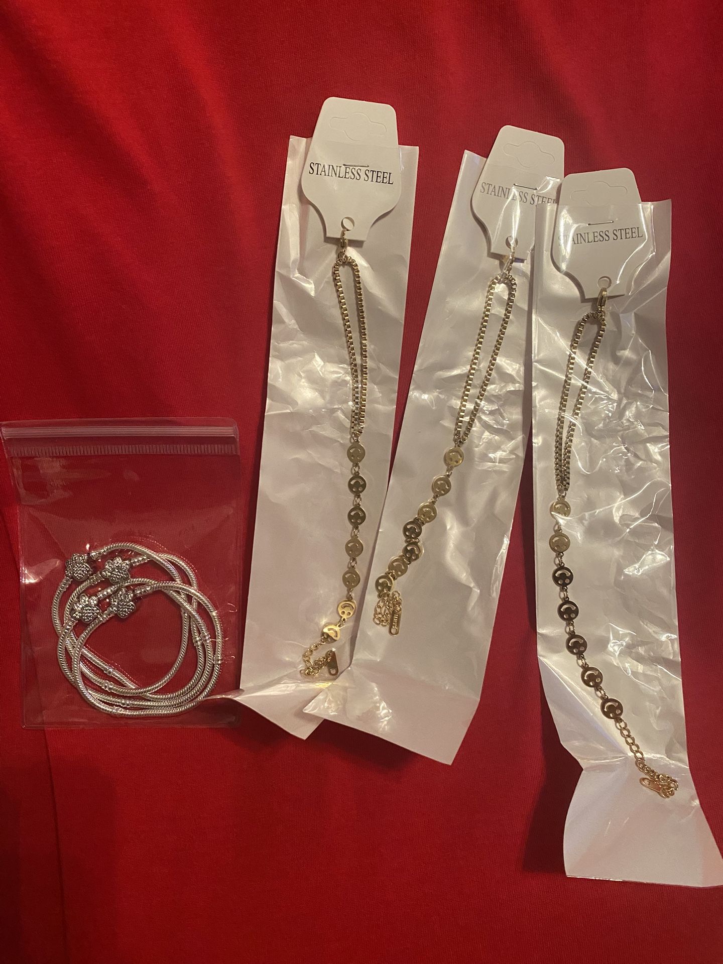 #4 silver 925 charms bracelets and #3 Stainless steel happy face bracelets