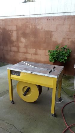 Poly strapping machine