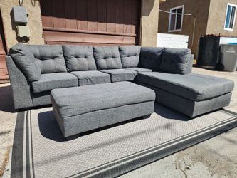 Grey Living Spaces Sectional Couch with Ottoman