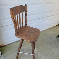 Solid Wood Swivel Barstool With Metal Footrest. Older Stool But Works Great.