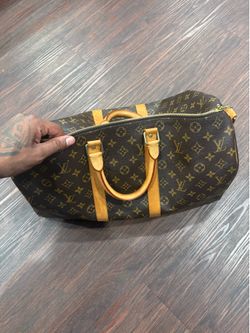 Lightly used LV Duffel bag with receipt!