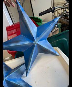 Set Of 2 Blue Metal Stars  $10/set . Pic up in Wellington  Can do porch pick up