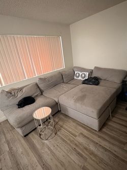 Couches , entertainment center and side table
