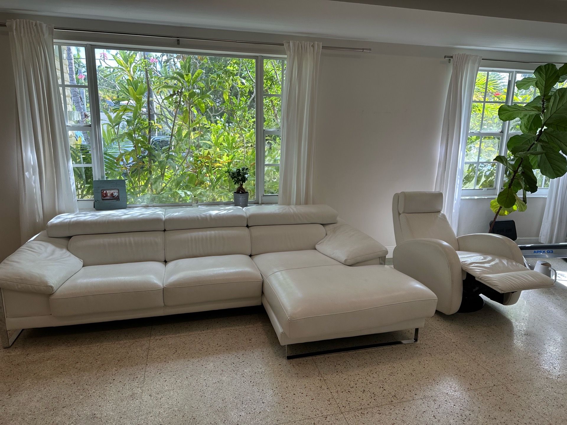 Italian-style white leather sectionals with adjustable headrests and chrome legs