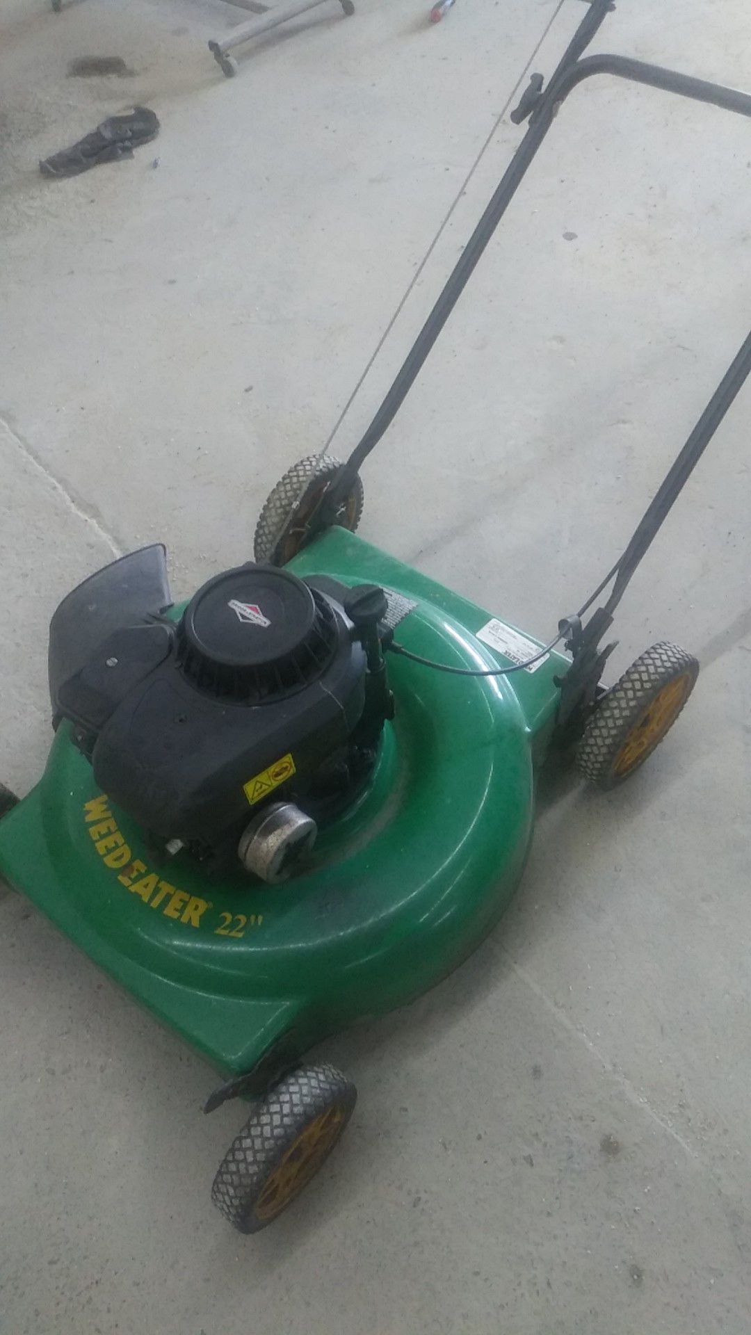 Very nice push mower with just four wheels Briggs & Stratton weed eater