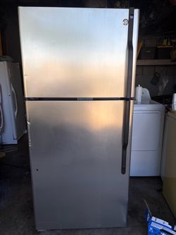 Stainless steel GE refrigerator in good condition.