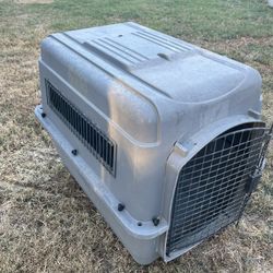 Medium- Large Sized Dog Crate. Used For A Large Breed Puppy. Has A Crack In It Near The Front, It’s On The Last Picture 