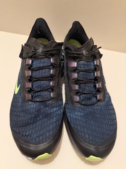 Nike Air Zoom Pegasus 37 FlyEase sneakers featuring a black and blue mesh upper with a zip-entry system and lime-green accents.