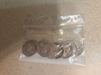 90 % silver quarters. 12 coins. Selling at spot