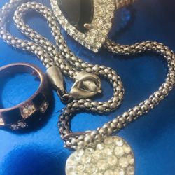 Heart necklace with rhinestones  on approximately 16” real silver snake chain. Two  rings in dramatic black and rhinestones. Vintage 