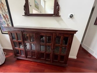 Vintage wooden sideboard with with glass doors