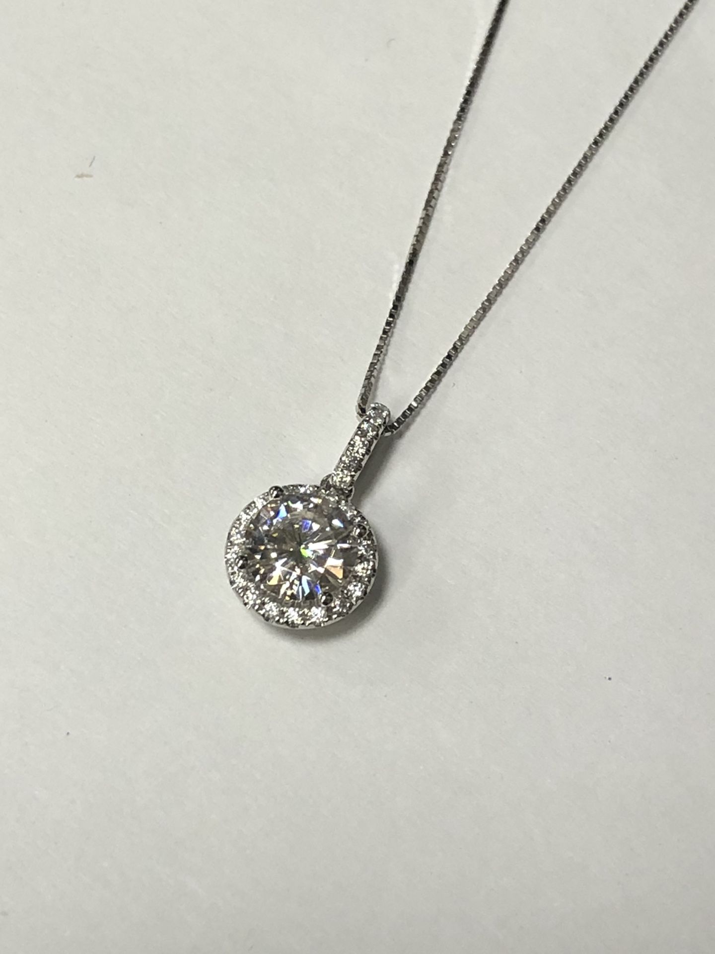 Gold and moissanite pendant