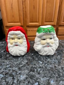 Vintage Ceramic Santa Claus Head pair of Salt and Pepper Shakers.  Size appropriately 3 inches tall.  Preowned.  Has been on display in a cabinet with