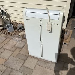 Sharp Air Conditioner with all parts, hoses, remote,etc