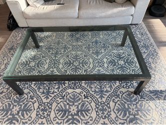 Metal coffee table with glass top