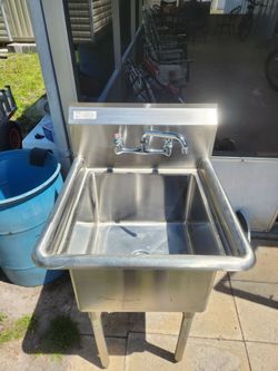 commercial-grade stainless steel prep and utility sink with a faucet