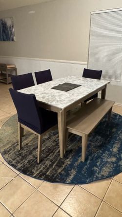 Dining table with 4 chairs and a bench