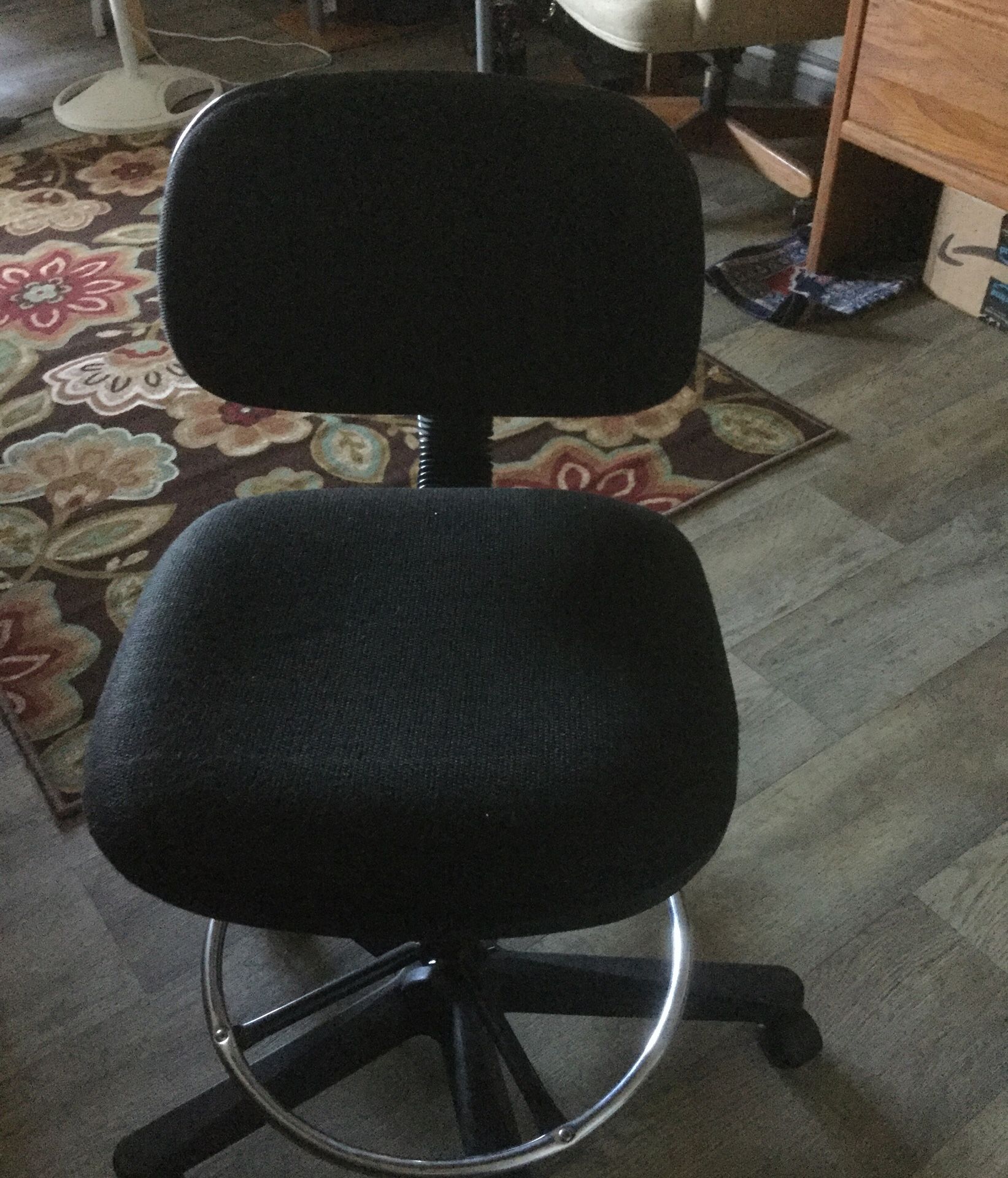 Study chair adjustable height and has wheels in pretty good condition