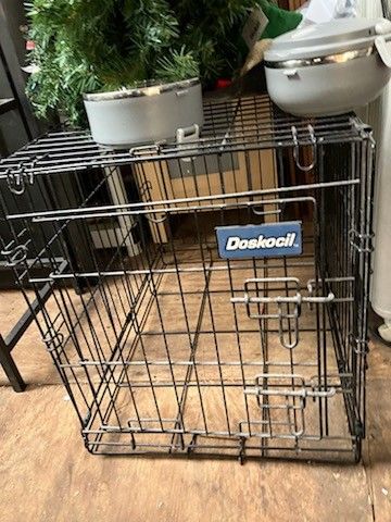Dog cage and doggy bowls