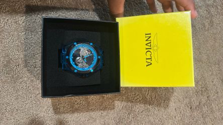 Invicta speedway watch with blue translucent case and a black silicone strap
