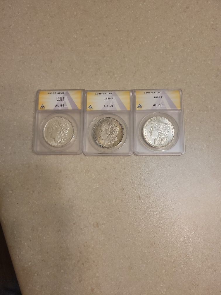 Graded Morgan Silver Dollars.  One Left 1900