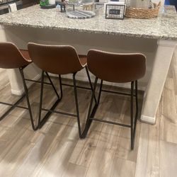 three kitchen stools