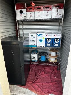 Storage unit items cameras, wires, network cabinet