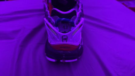 a pair of Balenciaga Runner sneakers in a multicolor and silver design with white laces.