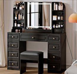 All black vanity with lights and chair