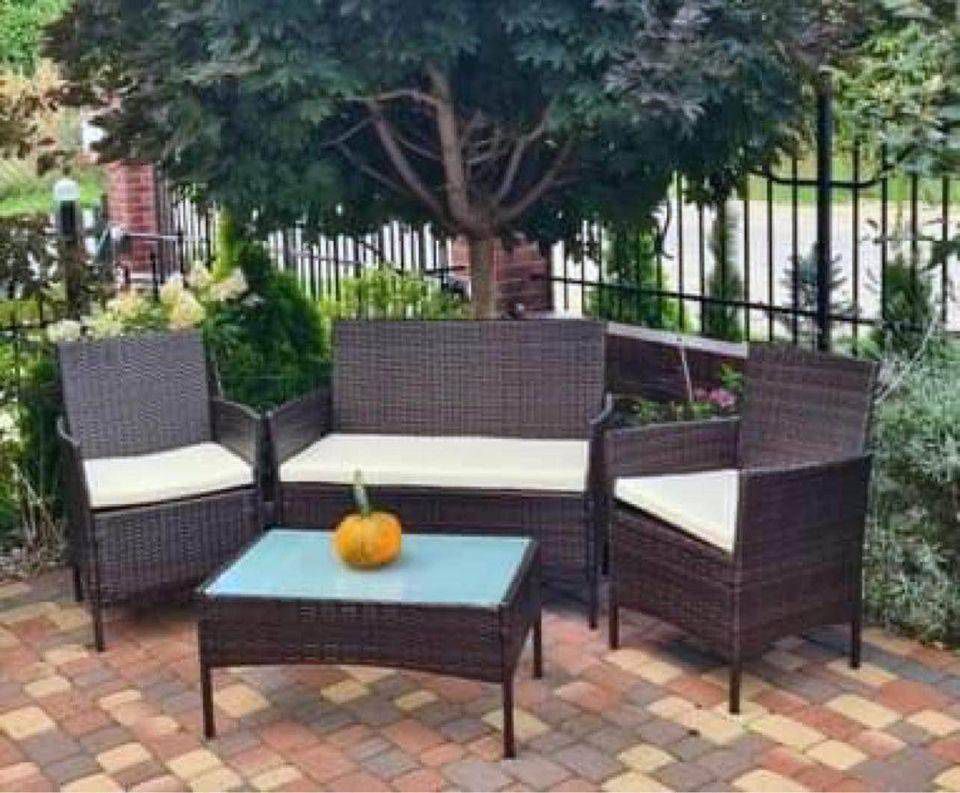 Patio Furniture Set New in Original Packaging 4 Piece All Weather Rattan With Cushions.