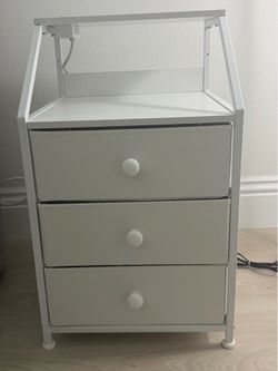 Two nightstands with built-in charging outlets