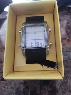 Dual time zone black watch..changes background colors with a press of a button..excellent for a gift or stocking stuffers