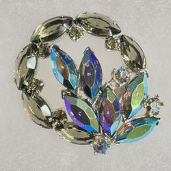 This is a vintage aurora borealis rhinestone brooch