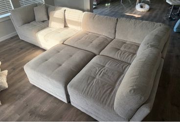 Sectional couch with two pillows