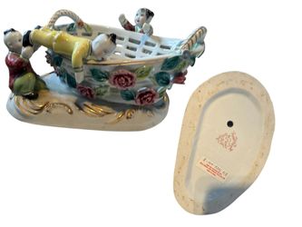 vintage 1950s porcelain china basket centerpiece adorned with figures of children and hand-painted flowers
