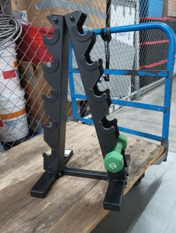 Sturdy black metal A-frame dumbbell rack has a five-tier design to store up to five pairs of weights.
This vertical stand helps organize gym equipme