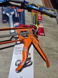 Orange Caulking gun
