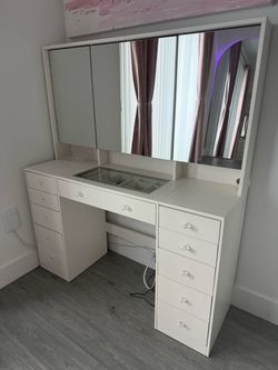 Vanity, white, with mirrors, lots of drawers and space. Perfect condition.