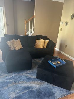 Black sectional with ottoman